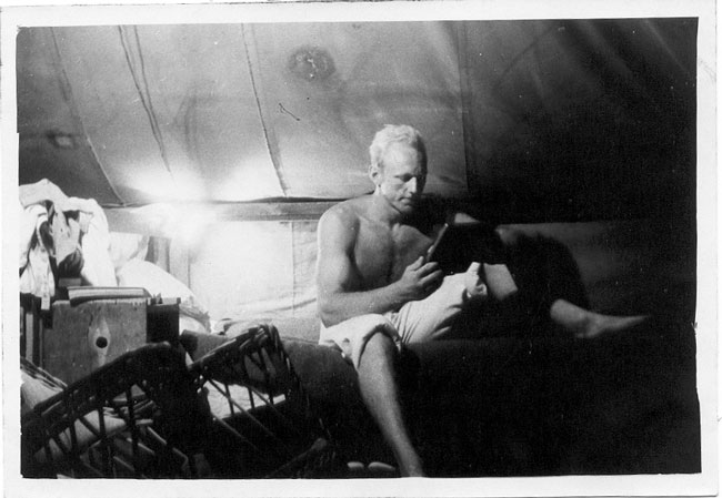 Bert Voortmeyer in his tent on Wake Island, Pan Am hotel construction project