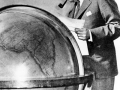 Iconic Image of Juan Trippe studying his globe, now on display at Smithsonian Institution