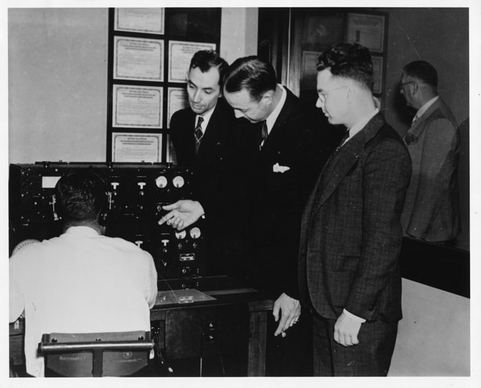 Sullinger & Leuteritz (center) with Pan Am Radio Operator (left)