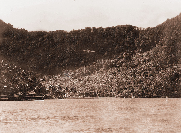 Samoan Clipper on Pago Pago approaching over the ridge, from Jon Krupnick Collection