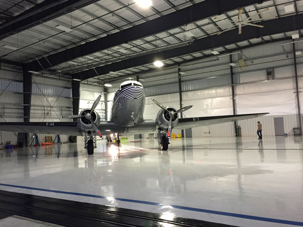 Tabitha May clipper nose on in hangar