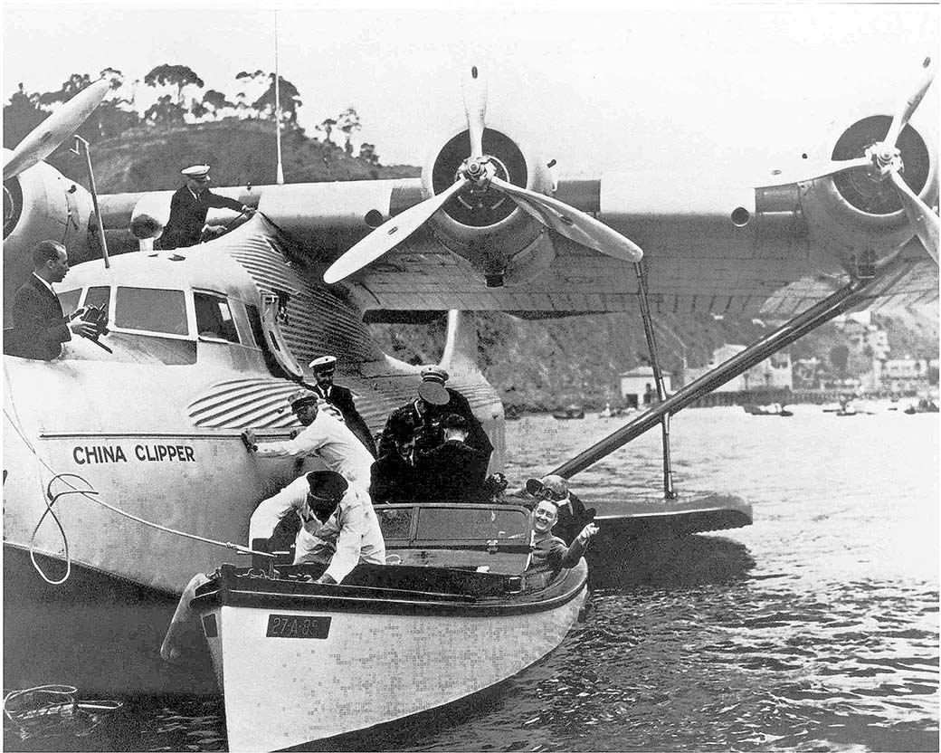 Glenn Martin waves as he deboards Pan Am "China Clipper" on May 10, 1937 for 25th anniversary of his historic flight to Catalina