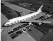 Pan Am Boeing 747 size comparison next a lines of automobiles