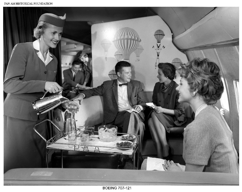 https://www.panam.org/images/igallery/resized/4101-4200/Pan_Am_Stewardess_serving_passengers_on_Boeing_707_jet_clipper-4137-1400-900-100-c.jpg