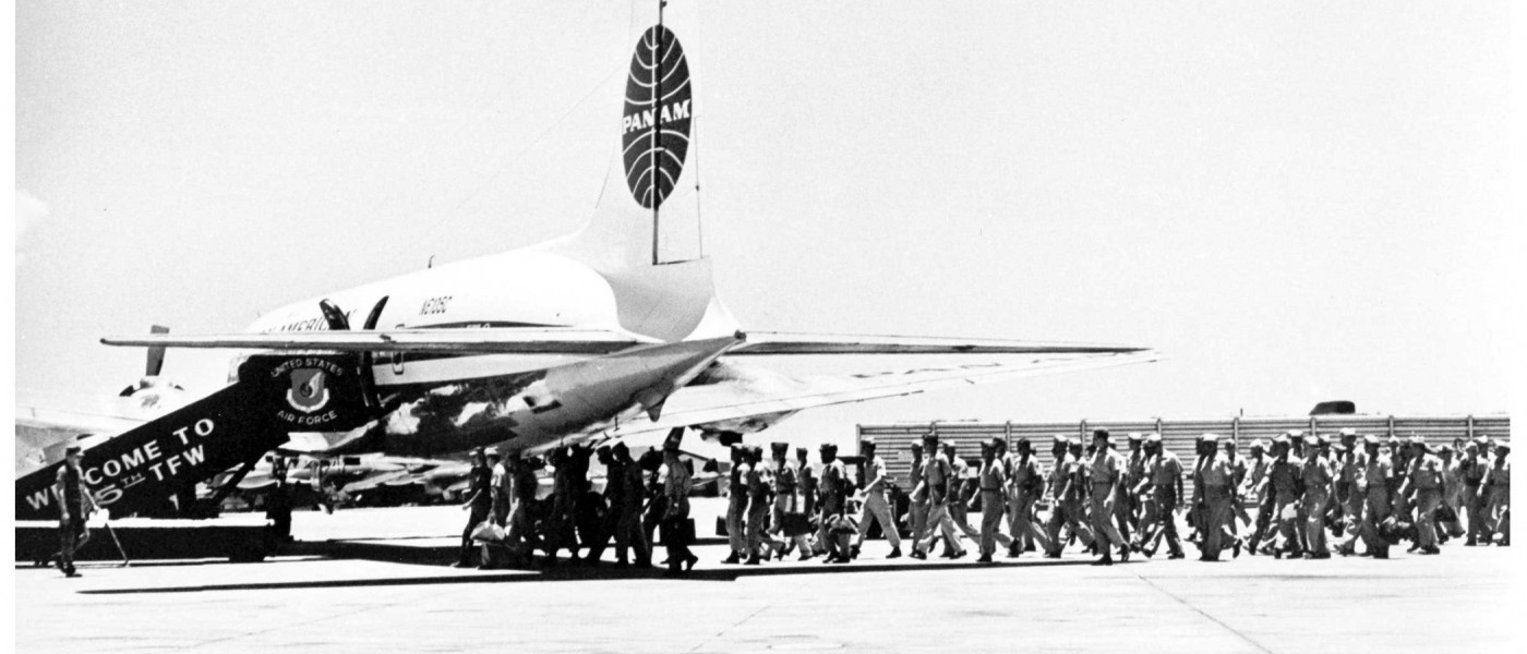 US Servicement Boarding a DC-6B, Vietnam, 1960s