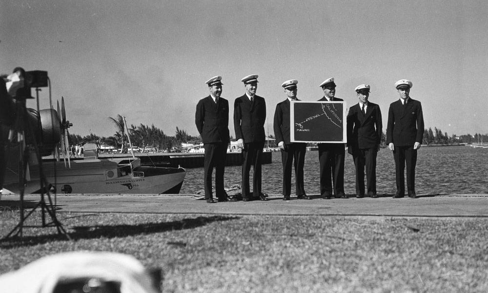 Ed Musick & Crew at Dinner Key display map of Pacific before take off to California, March 1935